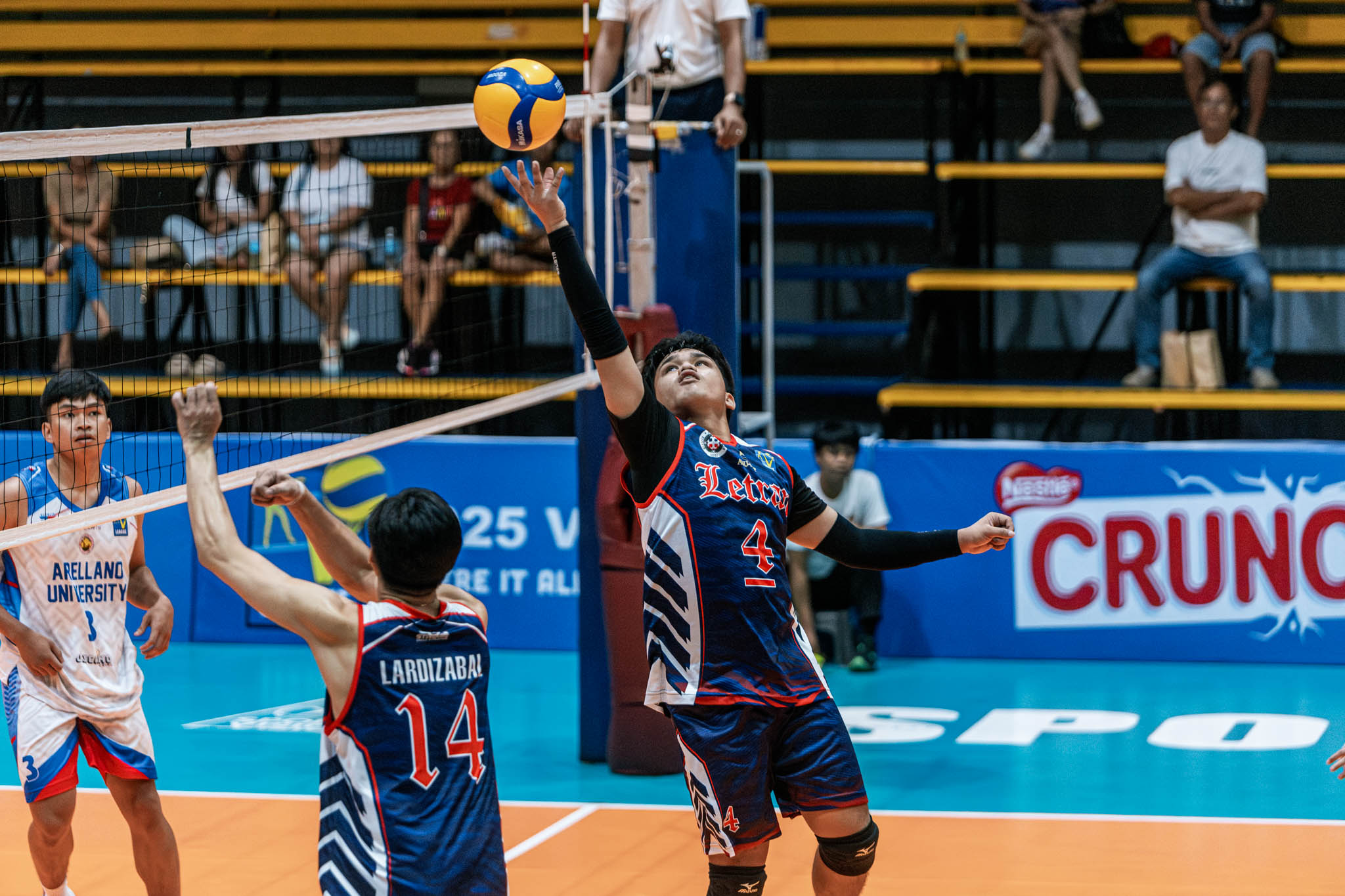 Letran finally solves Arellano for first win